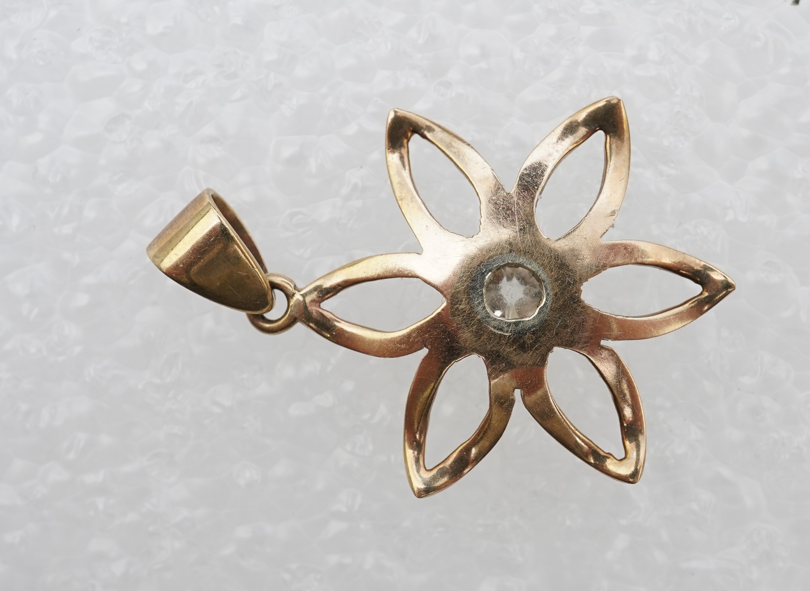 A gold and diamond pendant, mid 20th century